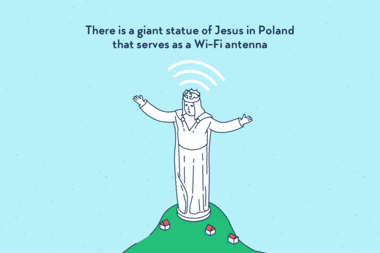 A tall white statue of Jesus, arms spread, standing on top of a hill. His head is emitting a Wi-Fi signal.